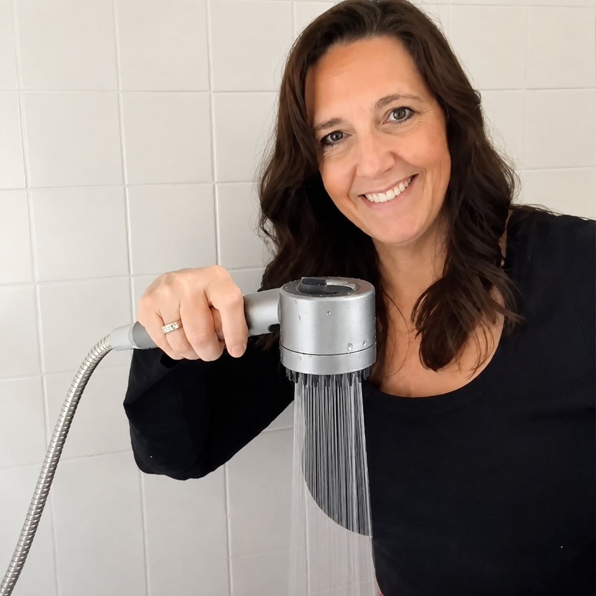 IonDrops shower head in use
