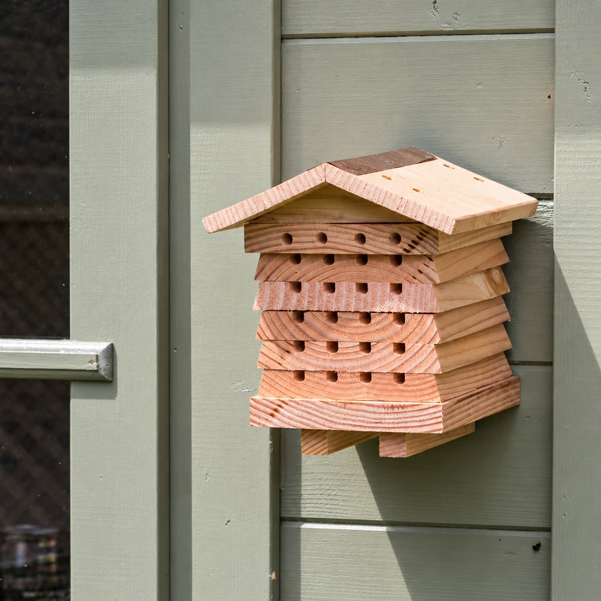 Wild Bee Hotel mounted on an exterior wall; representative view of one hotel in the 3 Pack